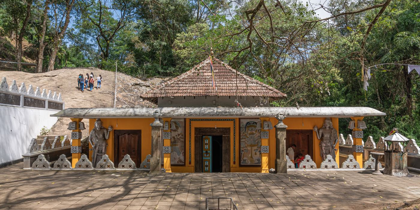 The painted shrine building and courtyard at Dowa Ancient Rock Temple, a stop on the Ella day trip