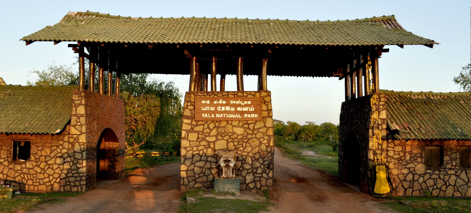 The entrance gate to Yala National Park with safari jeeps waiting to enter